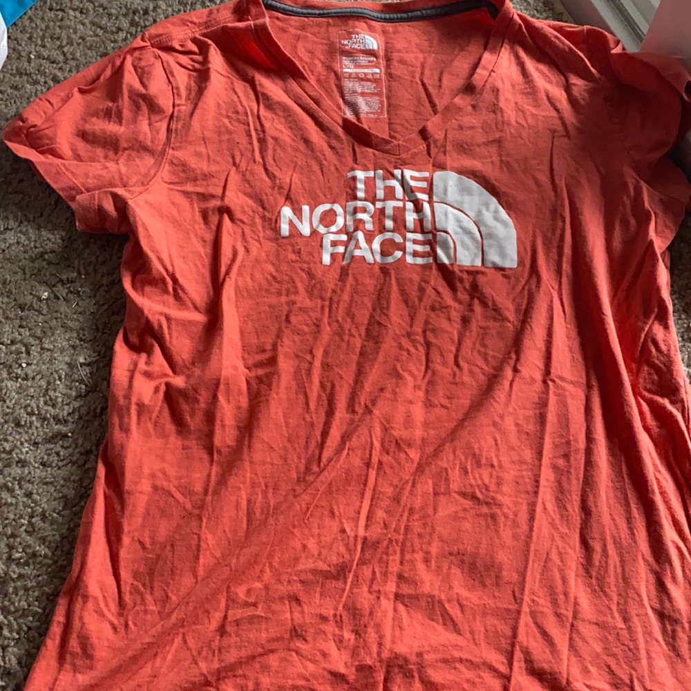 TWO Women’s North Face t-shirts.